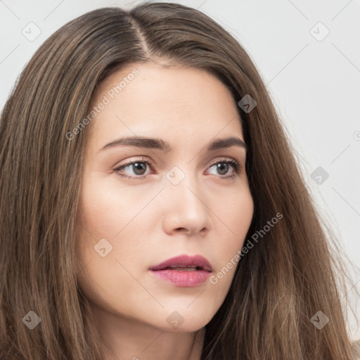 Neutral white young-adult female with long  brown hair and brown eyes