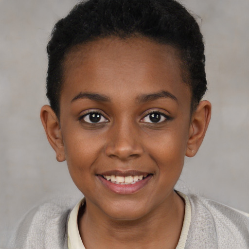 Joyful black child female with short  brown hair and brown eyes