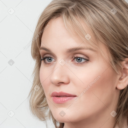 Joyful white young-adult female with medium  brown hair and blue eyes