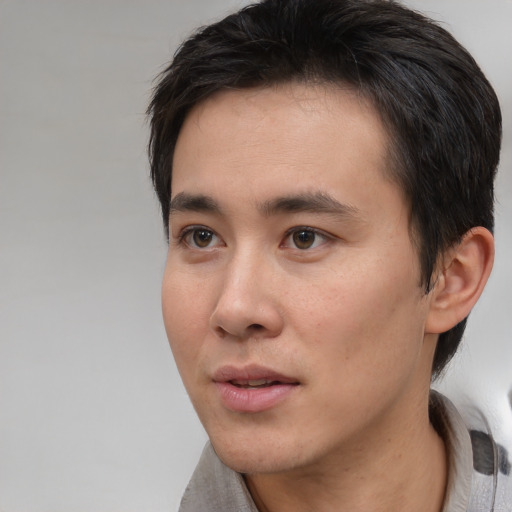 Neutral white young-adult male with short  black hair and brown eyes