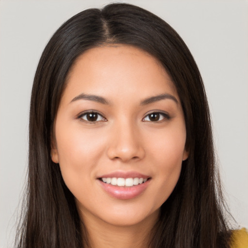 Joyful white young-adult female with long  brown hair and brown eyes