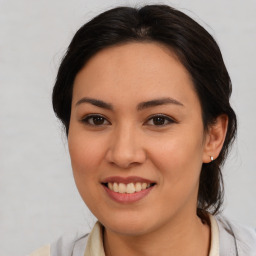 Joyful latino young-adult female with medium  brown hair and brown eyes