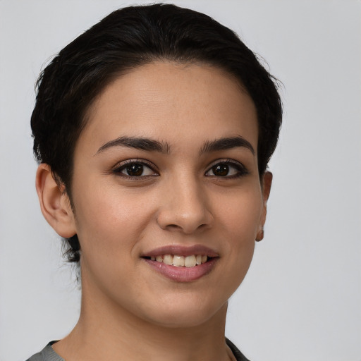 Joyful white young-adult female with short  brown hair and brown eyes