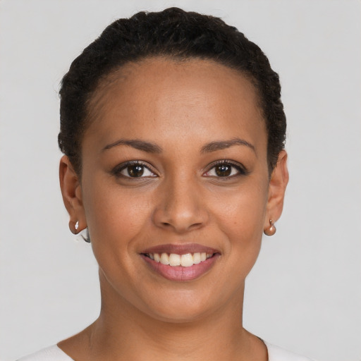 Joyful latino young-adult female with short  brown hair and brown eyes