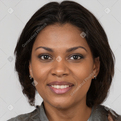 Joyful black young-adult female with medium  brown hair and brown eyes