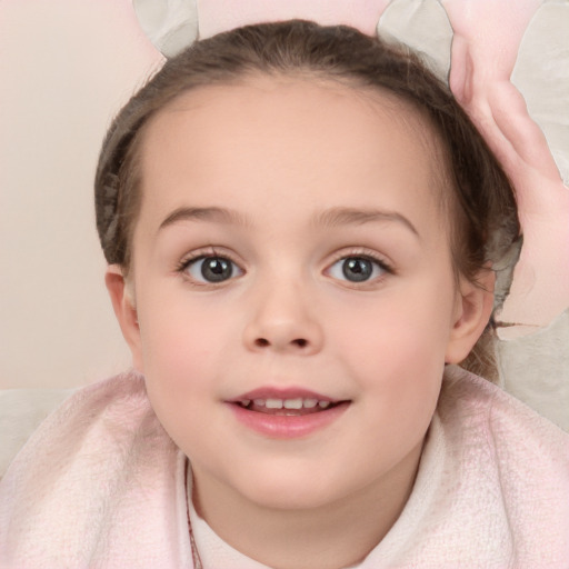 Joyful white child female with short  brown hair and blue eyes