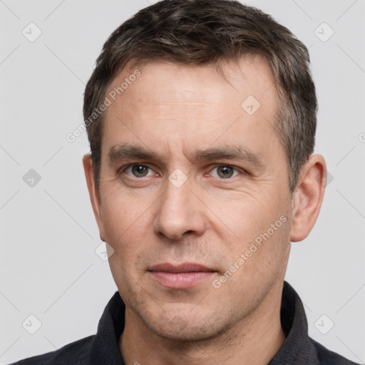 Neutral white adult male with short  brown hair and brown eyes