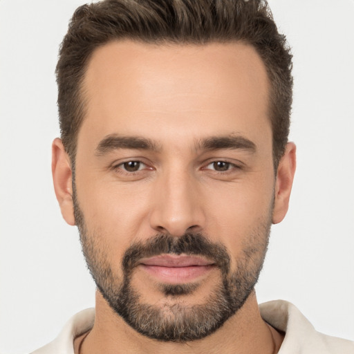 Joyful white young-adult male with short  brown hair and brown eyes