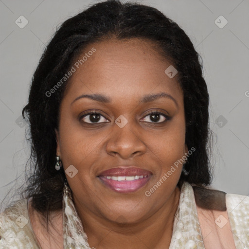 Joyful black adult female with medium  brown hair and brown eyes