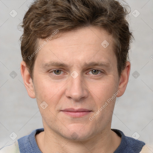 Joyful white adult male with short  brown hair and grey eyes