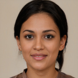 Joyful latino young-adult female with medium  brown hair and brown eyes