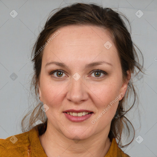 Joyful white adult female with medium  brown hair and brown eyes