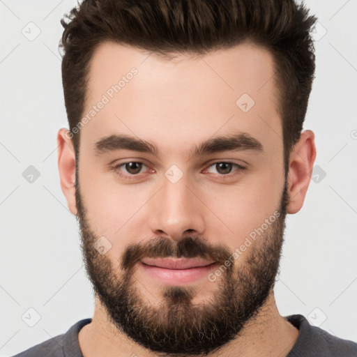 Joyful white young-adult male with short  brown hair and brown eyes