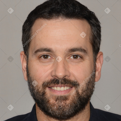 Joyful white adult male with short  black hair and brown eyes