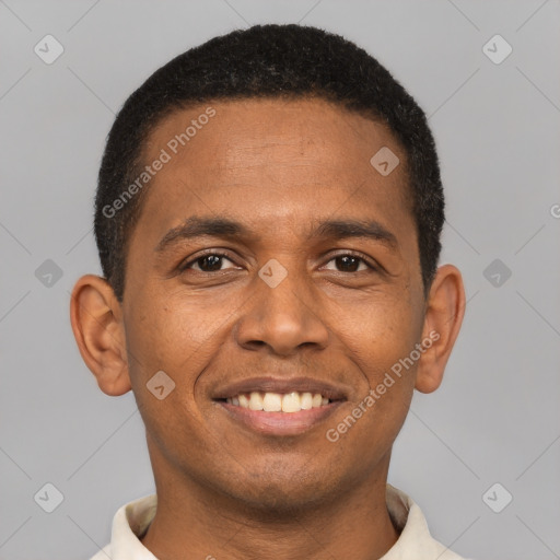 Joyful latino young-adult male with short  brown hair and brown eyes