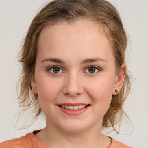 Joyful white child female with medium  brown hair and brown eyes