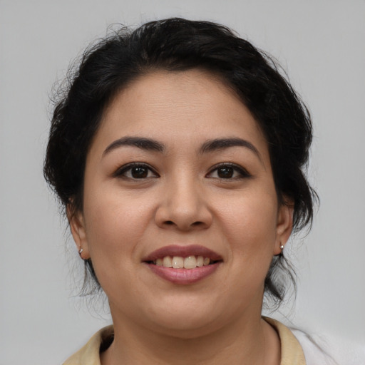 Joyful asian young-adult female with medium  brown hair and brown eyes