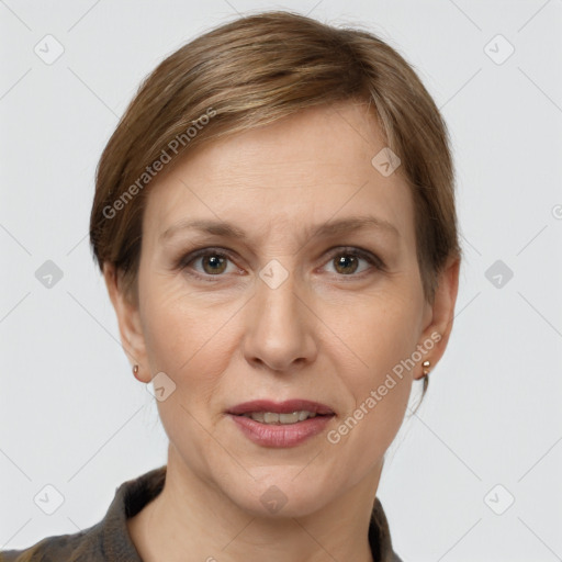 Joyful white adult female with short  brown hair and grey eyes