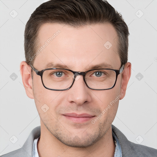 Joyful white young-adult male with short  brown hair and grey eyes