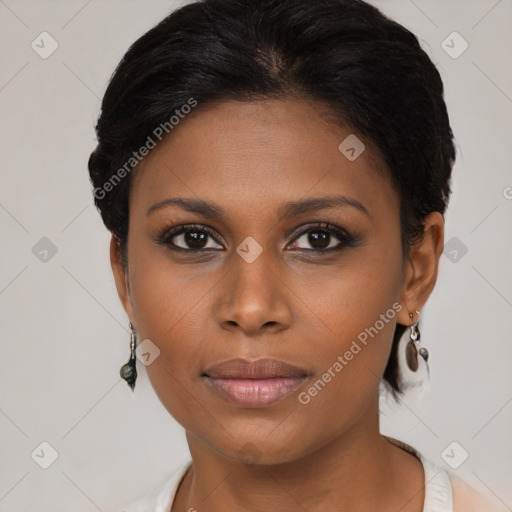 Joyful black young-adult female with short  brown hair and brown eyes