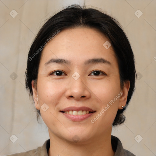 Joyful white young-adult female with medium  brown hair and brown eyes