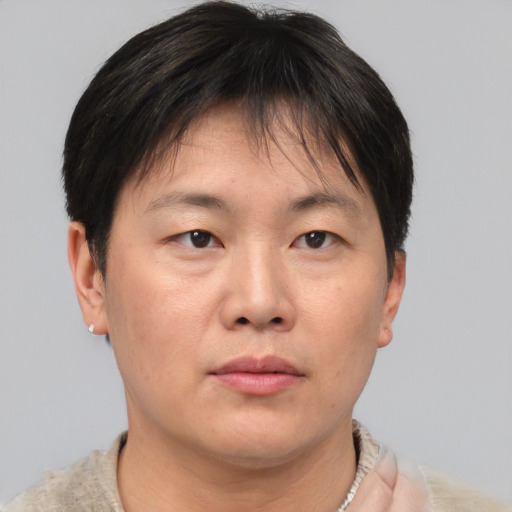 Neutral asian adult female with short  brown hair and brown eyes