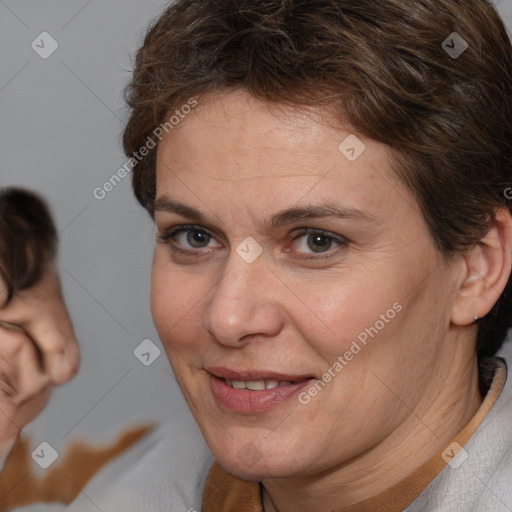 Joyful white adult female with short  brown hair and brown eyes