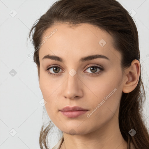 Neutral white young-adult female with long  brown hair and brown eyes