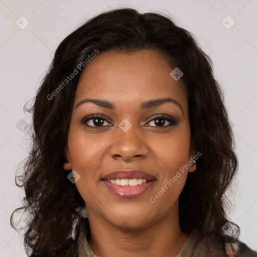 Joyful black young-adult female with long  brown hair and brown eyes