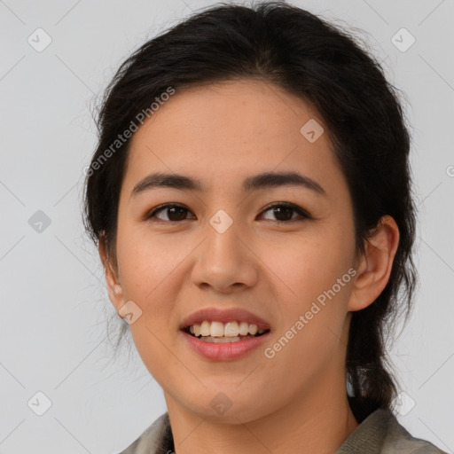 Joyful latino young-adult female with medium  brown hair and brown eyes