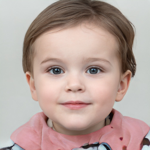 Joyful white child female with short  brown hair and blue eyes