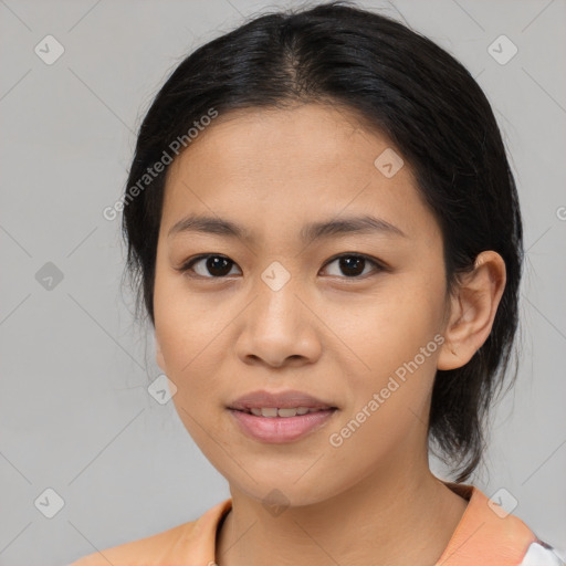 Joyful asian young-adult female with medium  black hair and brown eyes