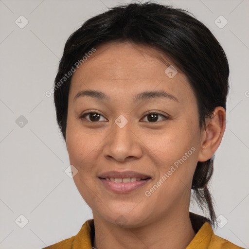 Joyful asian young-adult female with medium  brown hair and brown eyes