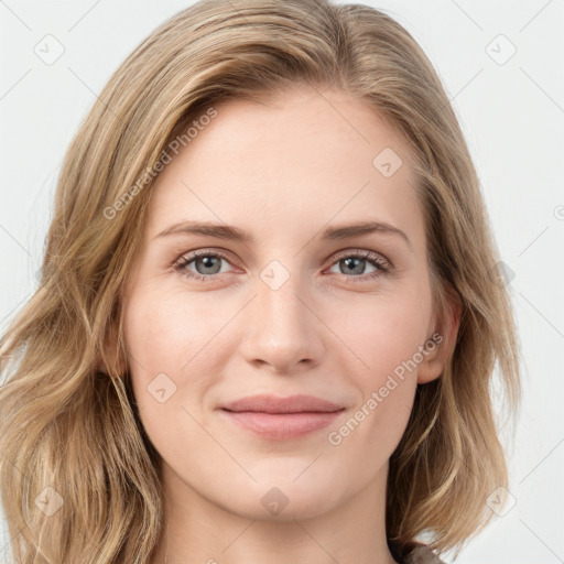 Joyful white young-adult female with long  brown hair and green eyes