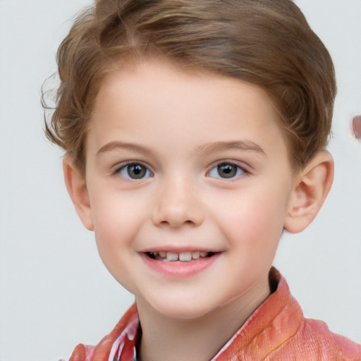 Joyful white child female with short  brown hair and blue eyes