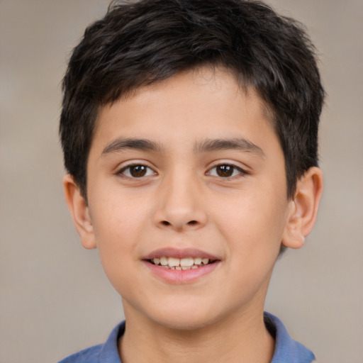 Joyful white child male with short  brown hair and brown eyes