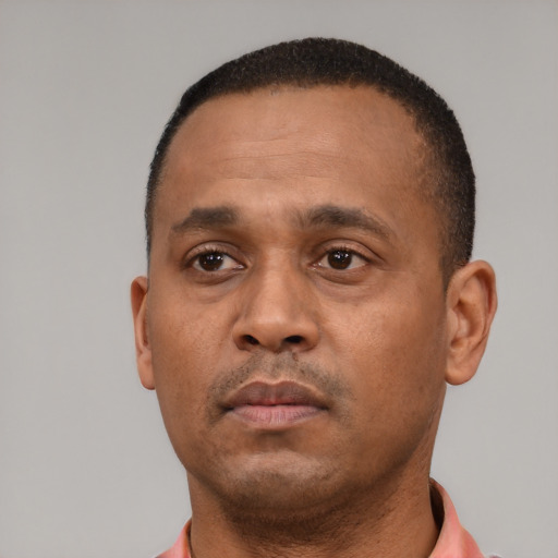 Neutral black adult male with short  black hair and brown eyes