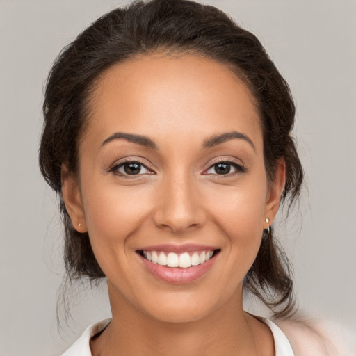 Joyful white young-adult female with medium  brown hair and brown eyes