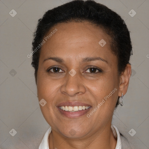 Joyful black adult female with short  brown hair and brown eyes