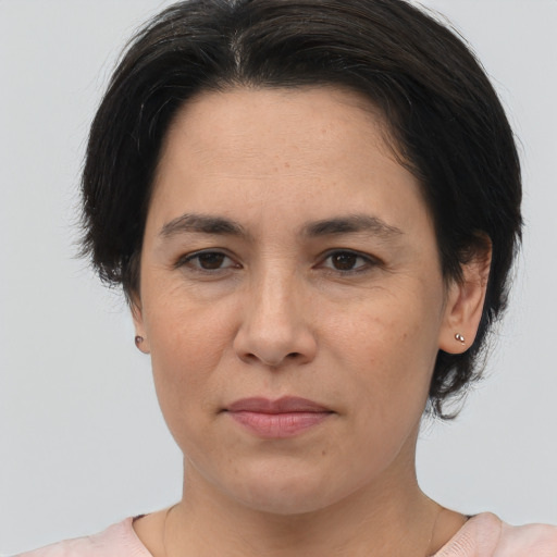 Joyful asian adult female with medium  brown hair and brown eyes
