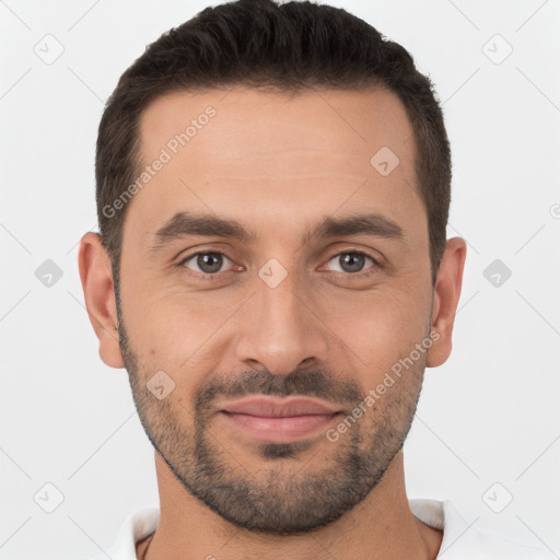 Joyful white young-adult male with short  brown hair and brown eyes