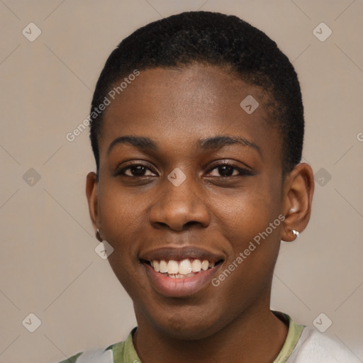 Joyful black young-adult female with short  black hair and brown eyes