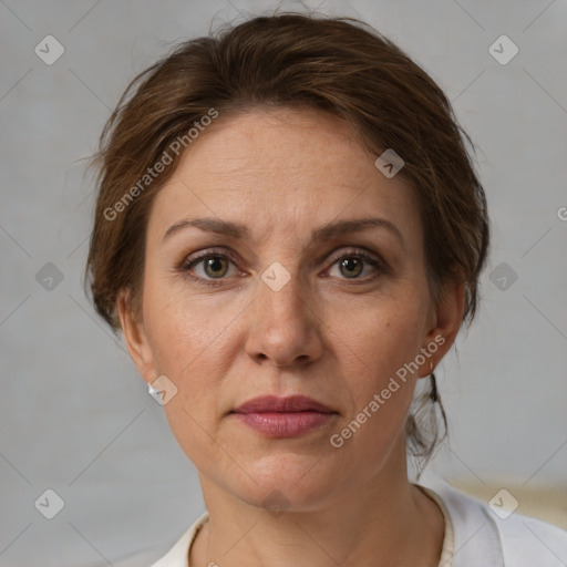 Joyful white adult female with short  brown hair and brown eyes