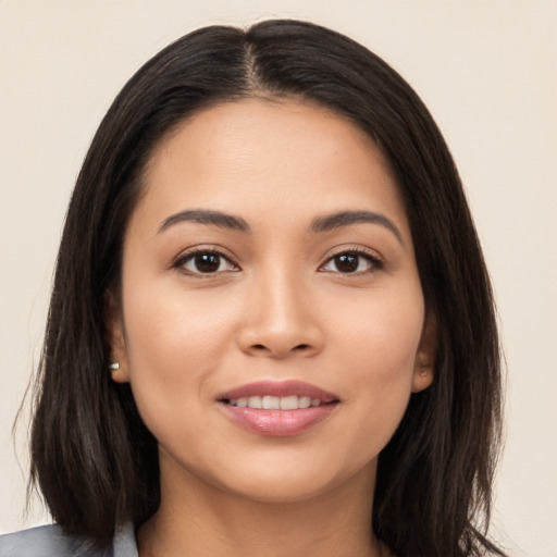 Joyful white young-adult female with long  black hair and brown eyes