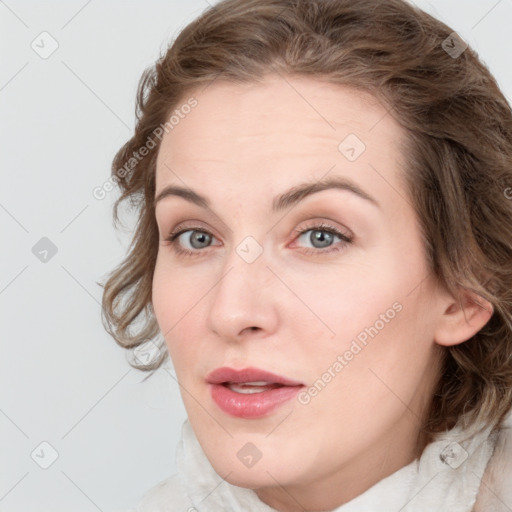 Joyful white young-adult female with medium  brown hair and blue eyes