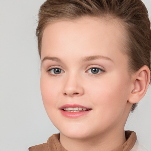 Joyful white child female with short  brown hair and brown eyes