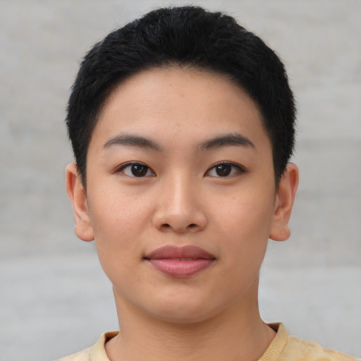 Joyful asian young-adult female with short  black hair and brown eyes