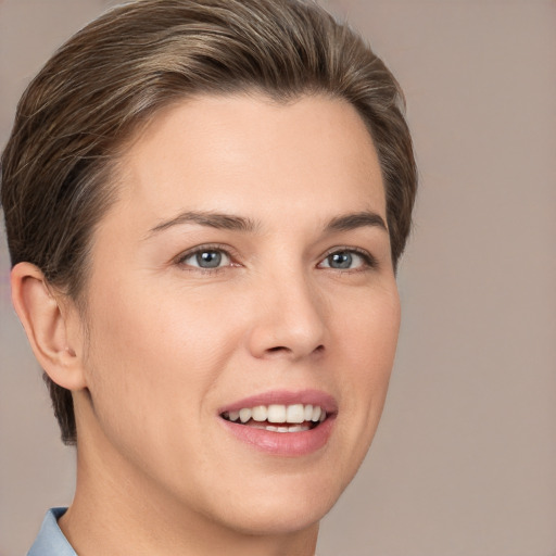 Joyful white young-adult female with short  brown hair and brown eyes