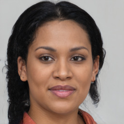 Joyful asian young-adult female with medium  brown hair and brown eyes