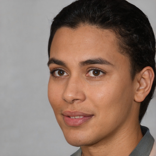 Joyful latino young-adult female with short  brown hair and brown eyes